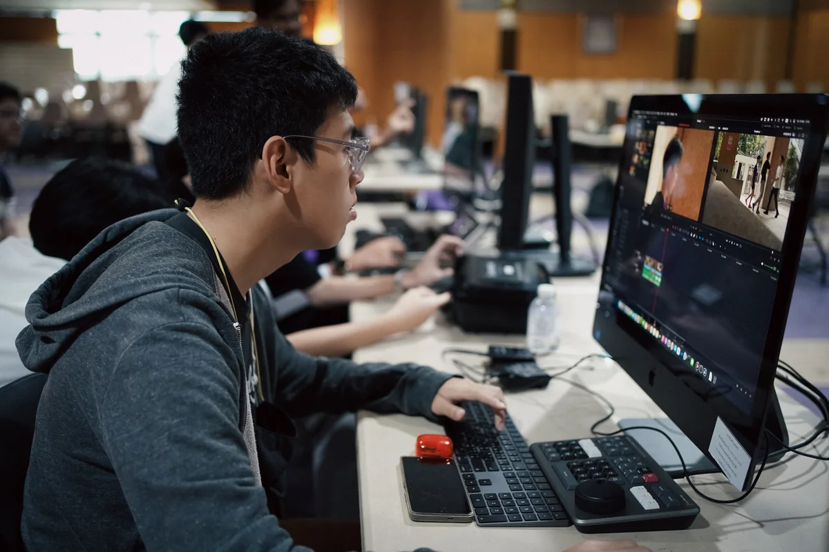 Students learning post-production and color grading