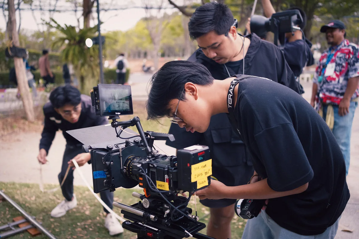Students operating a cinema camera during a WOZ workshop